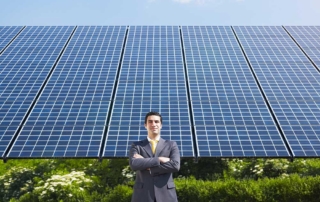 businessman in front of solar panels