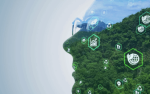 ai-and-sustainability. Silhouette of man's face. In the silhouette is a landscape of a green forest and clear sky.