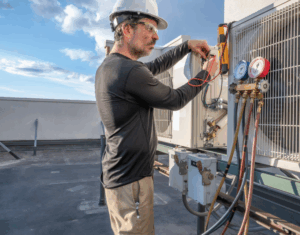 repairman with white hardhat fixing HVAC Toronto